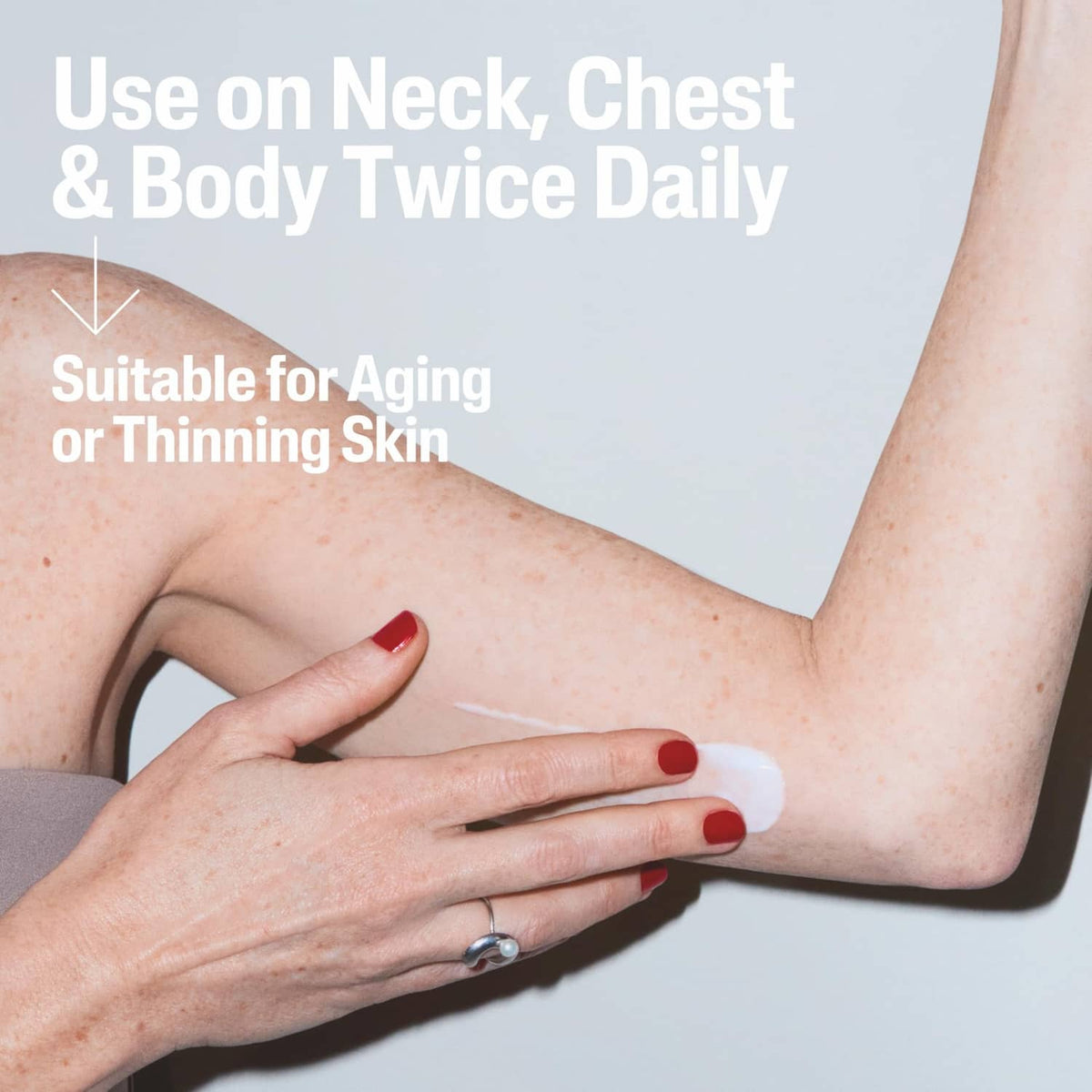 Skin cream applied to forearm with a white dollop from the Cetaphil jar