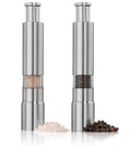 Stainless steel salt and pepper push-button grinders, two units with visible spices inside