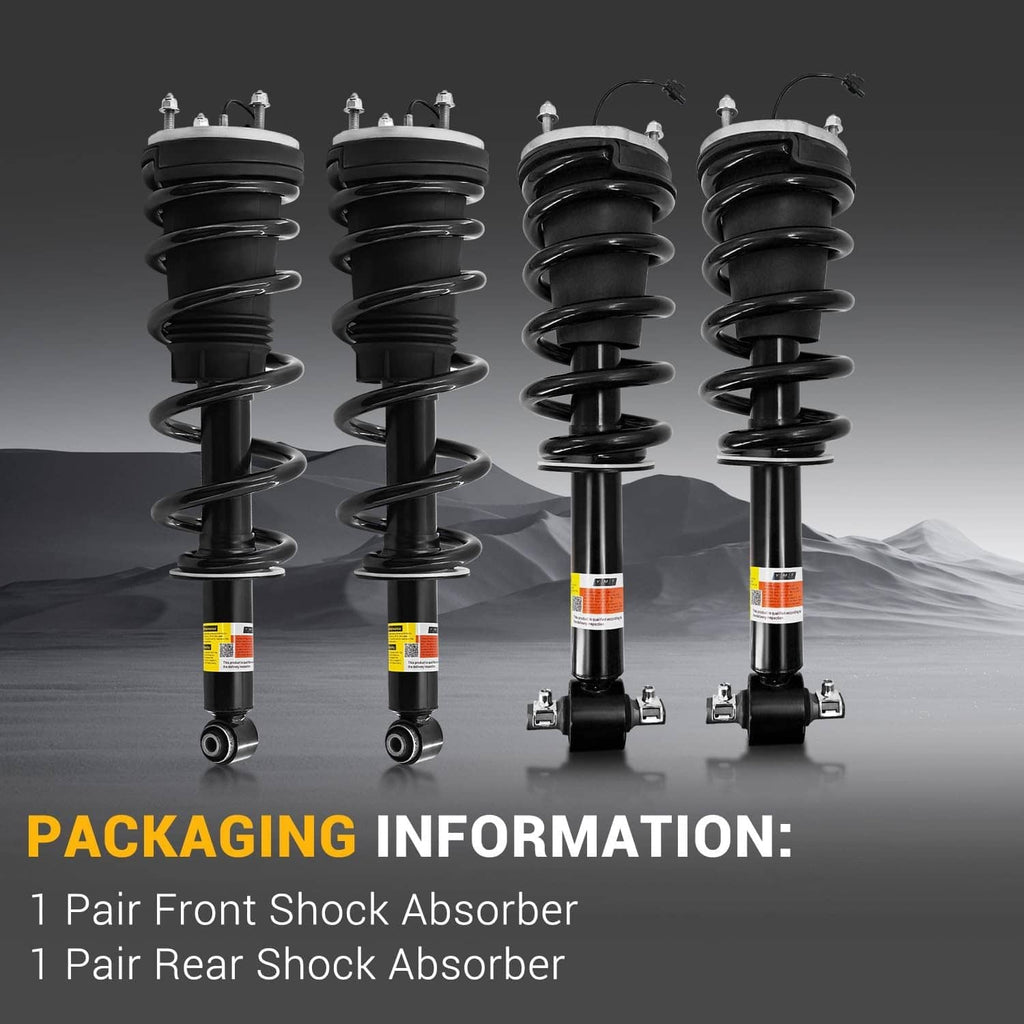 Four black shock absorber struts with coil springs and bottom mounts