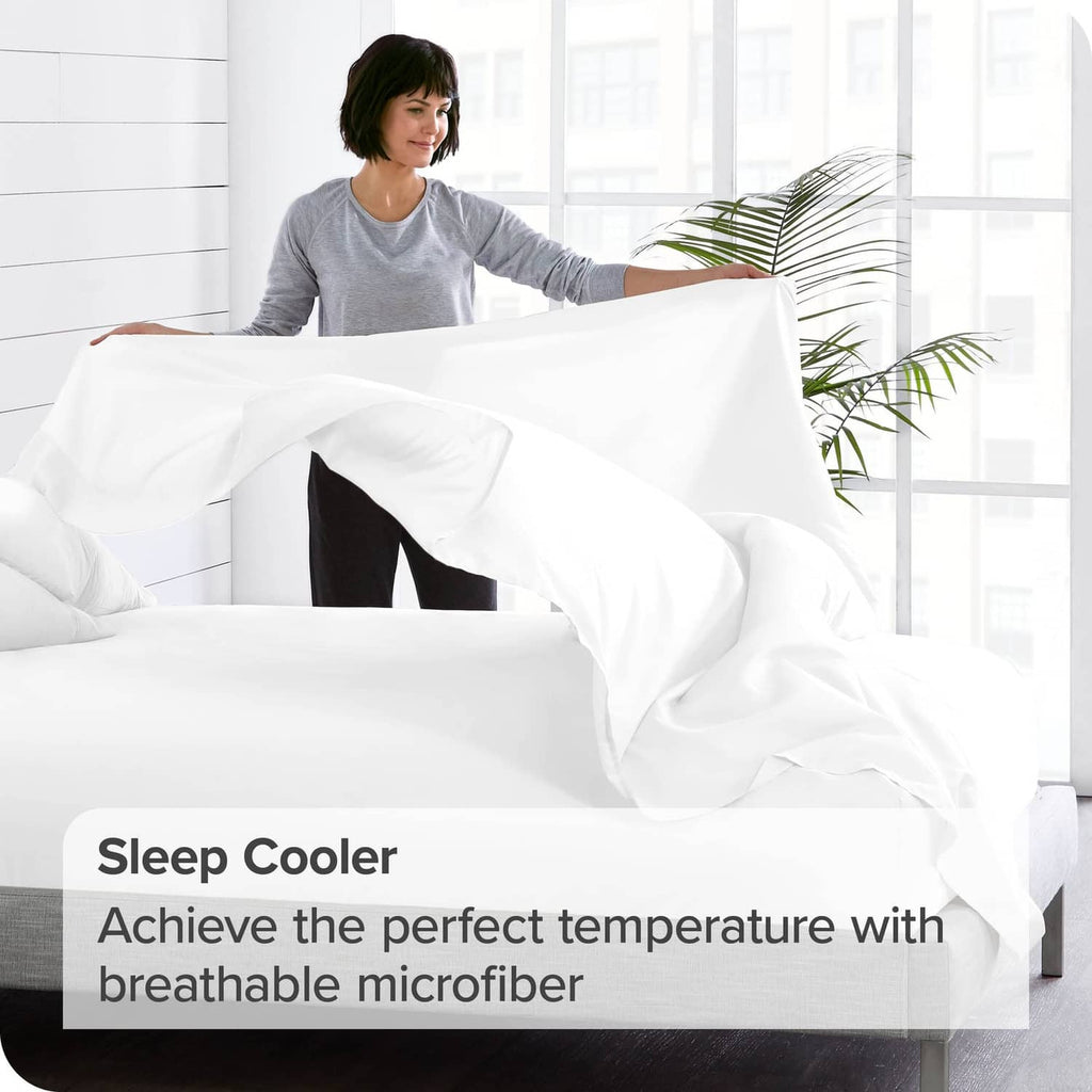 White twin flat sheet on a bed, neatly spread with smooth microfiber surface