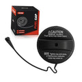 Black round fuel tank filler cap with caution label and hinged tether strap