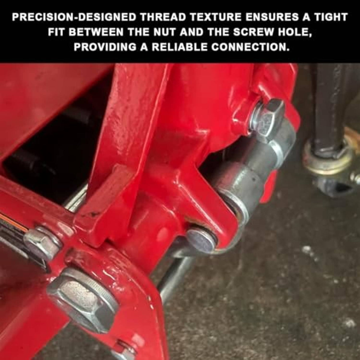 Close-up of threaded jack handle bolt and nut on red hydraulic floor jack