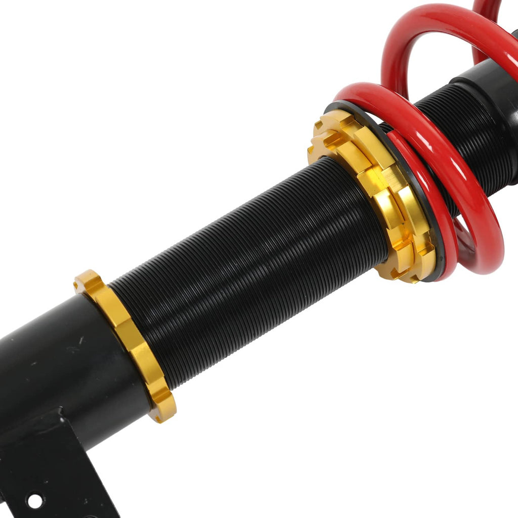 Coilover strut with black threaded body, gold adjust collar, and red spring