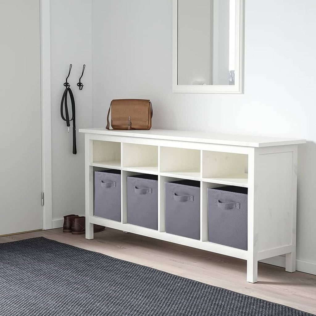 Gray fabric storage cubes with front handles, set in a row on a bench