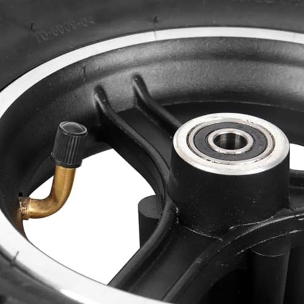 Scooter tire valve and inner rim area, black rubber with silver bearing ring