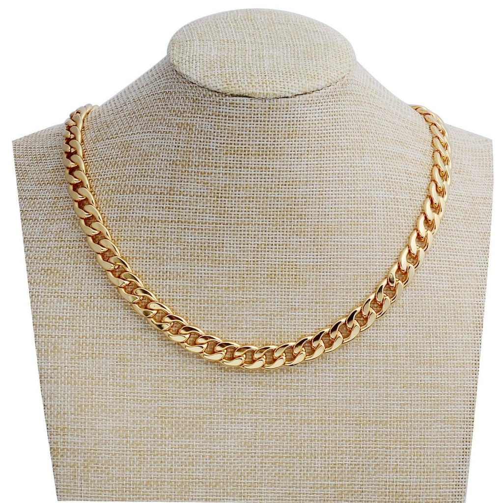 Gold chain necklace with chunky curb links on a beige display bust