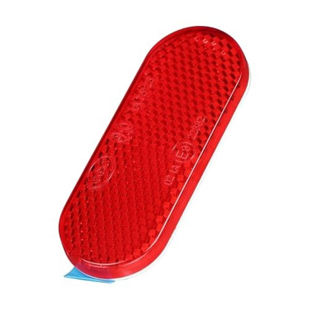 Single red oval reflector sticker with raised reflective texture and blue backing tab