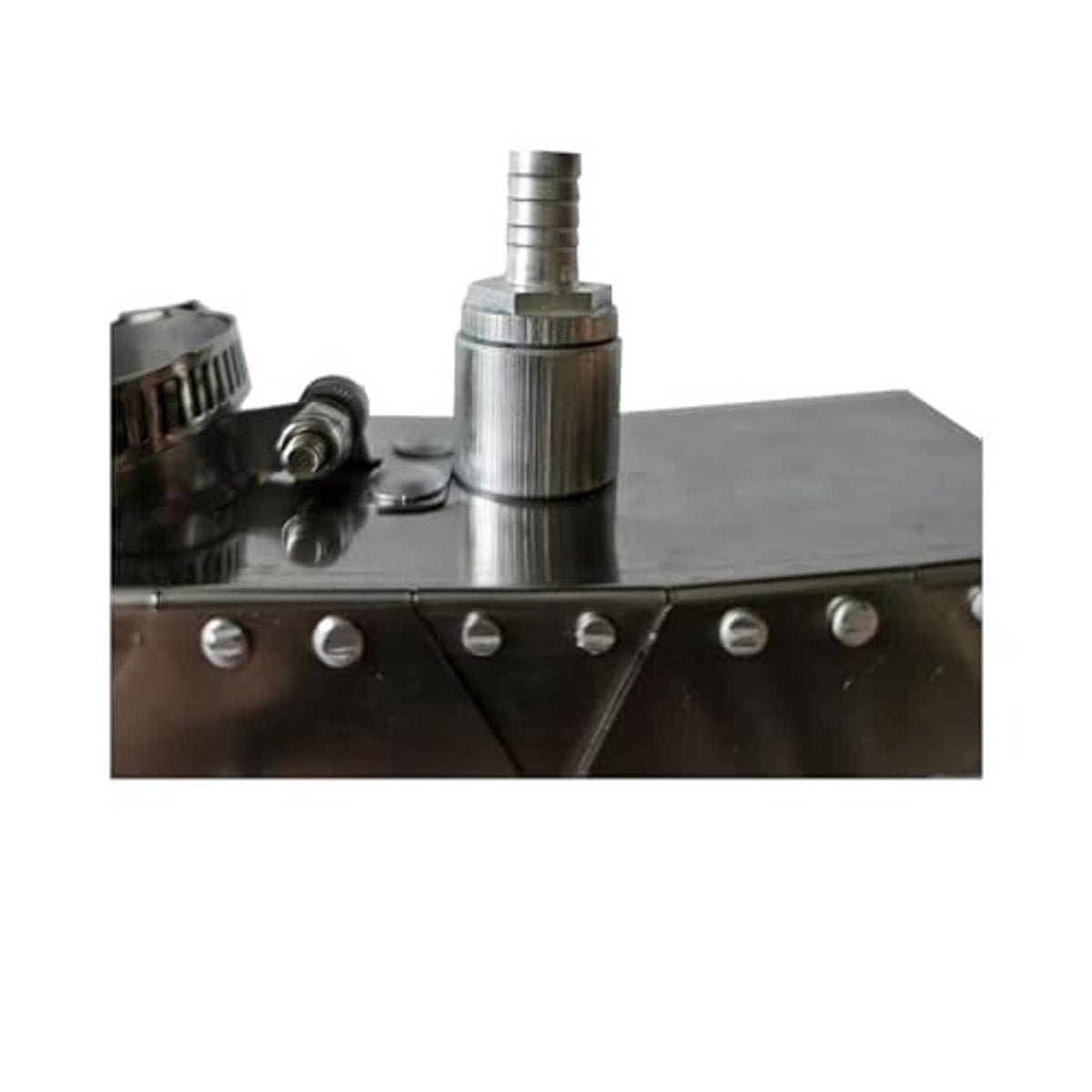 TIG welding trailing shield close-up with row of mounting holes and raised stand tube