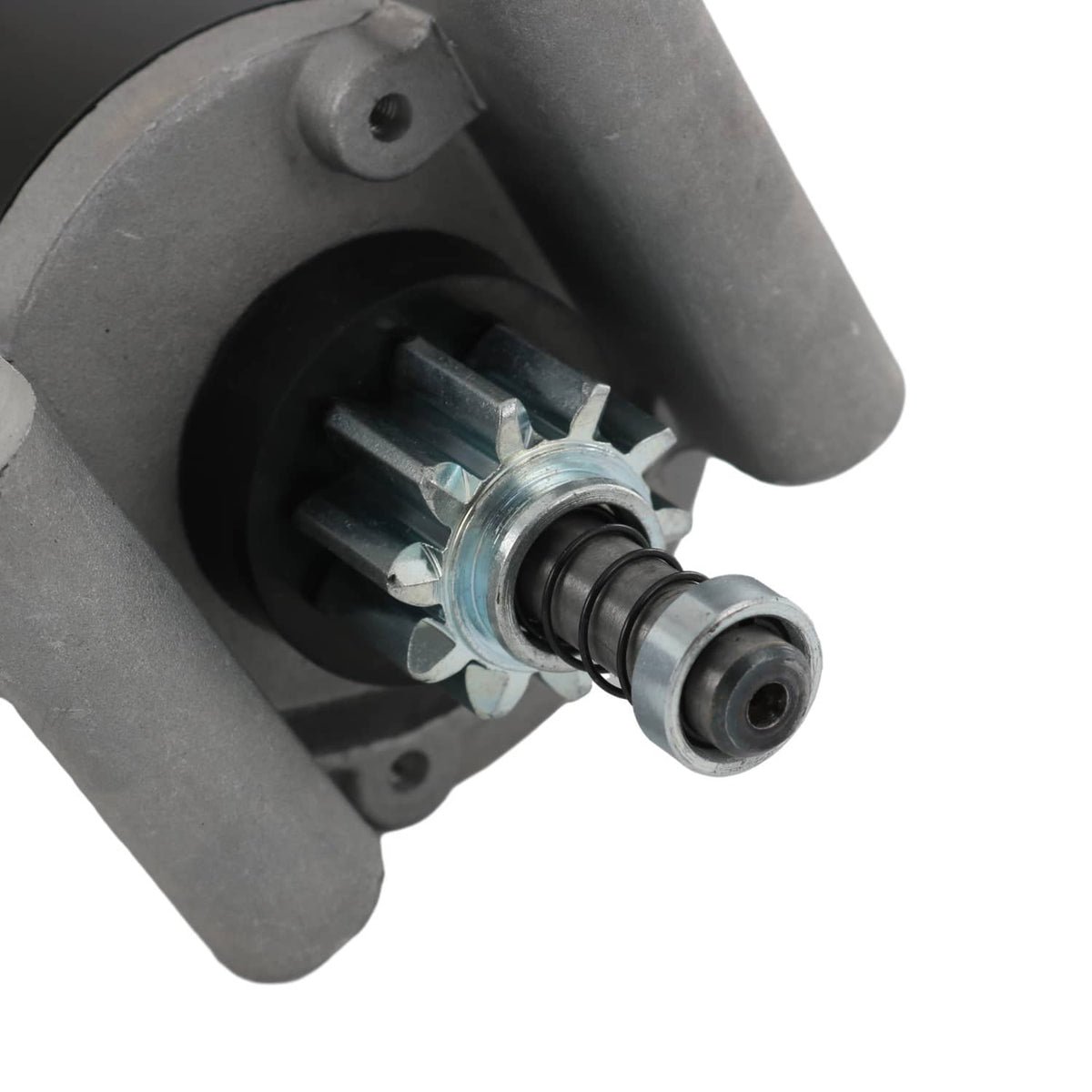 Starter motor drive end with black pinion gear and silver bracket mount