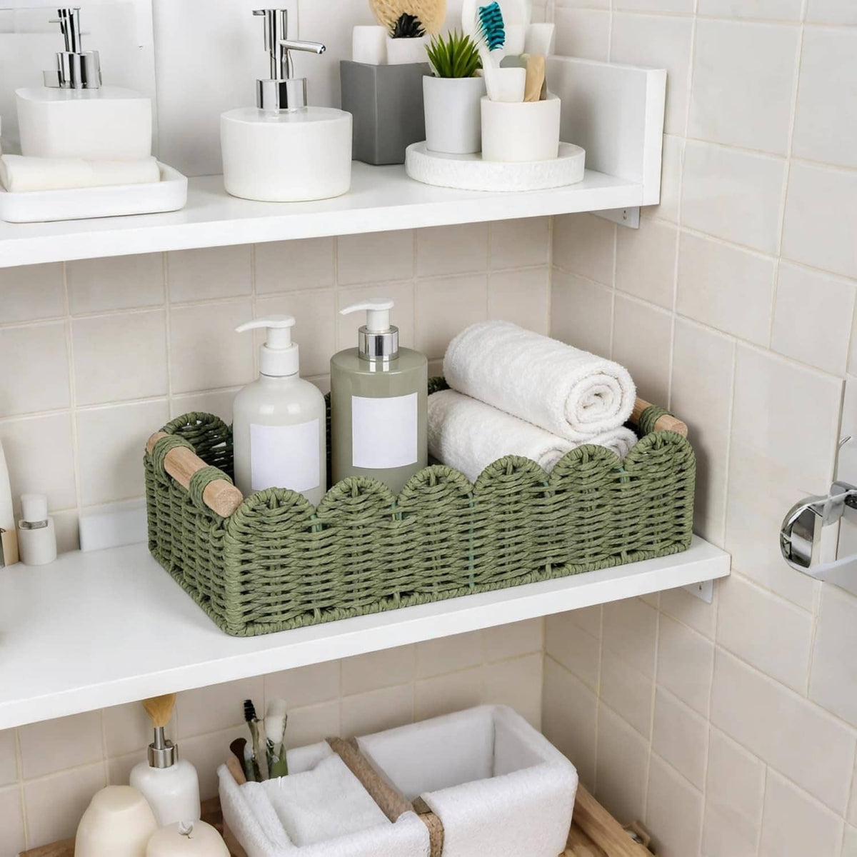 Green woven scalloped storage basket with wood handles on bathroom shelf