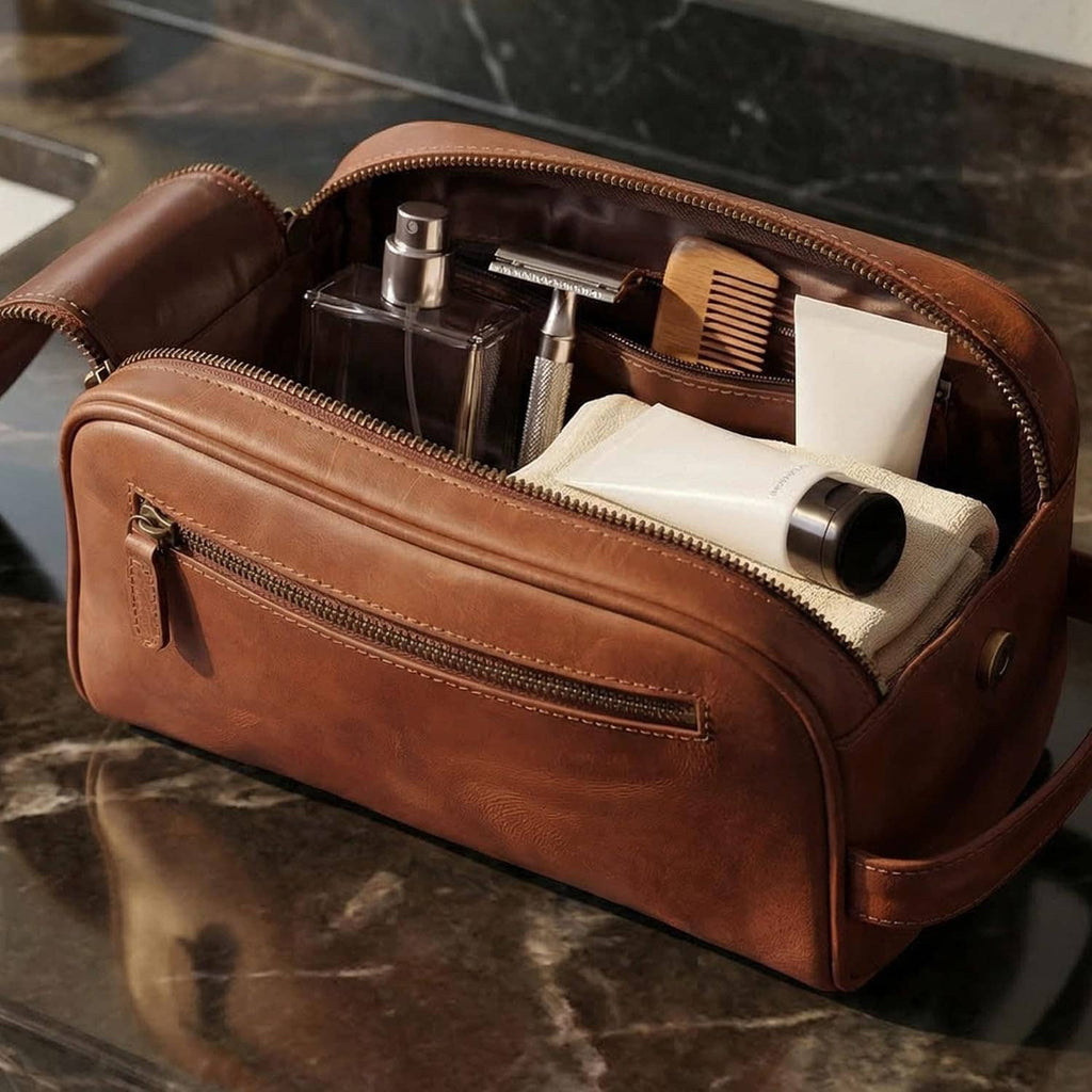 Open brown leather toiletry bag with grooming bottles and tubes in inner compartments