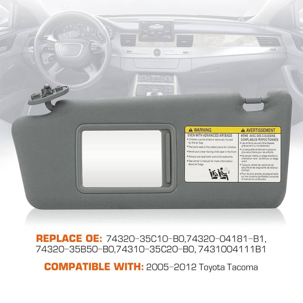Gray sun visor installed in car interior, rectangular mirror window and mounting clips.