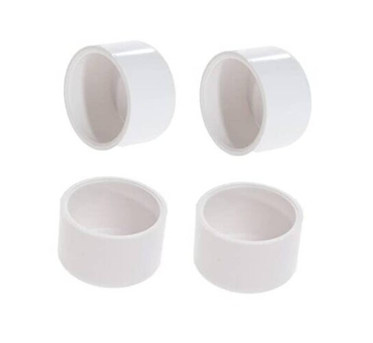 Set of four white PVC pipe end plug caps with open round interiors