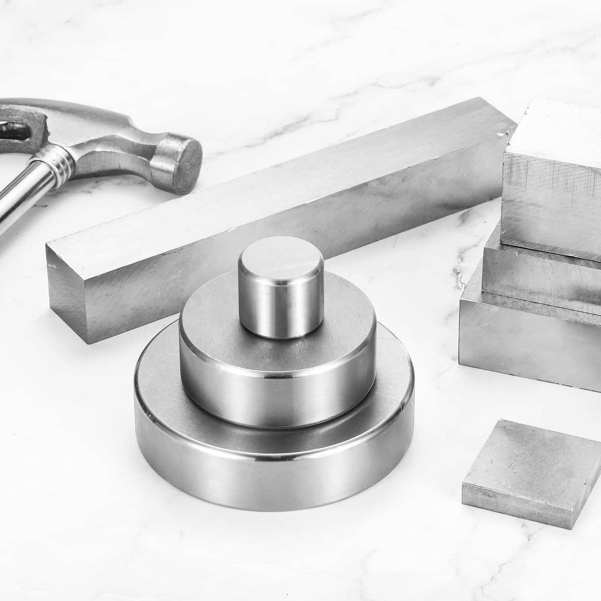 Round steel bench block with cylindrical top, silver finish, metal supports