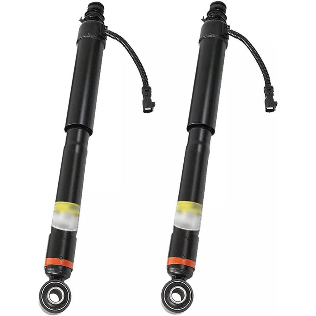 Pair of black shock absorber strut assemblies with mounting bushing and wiring pigtail