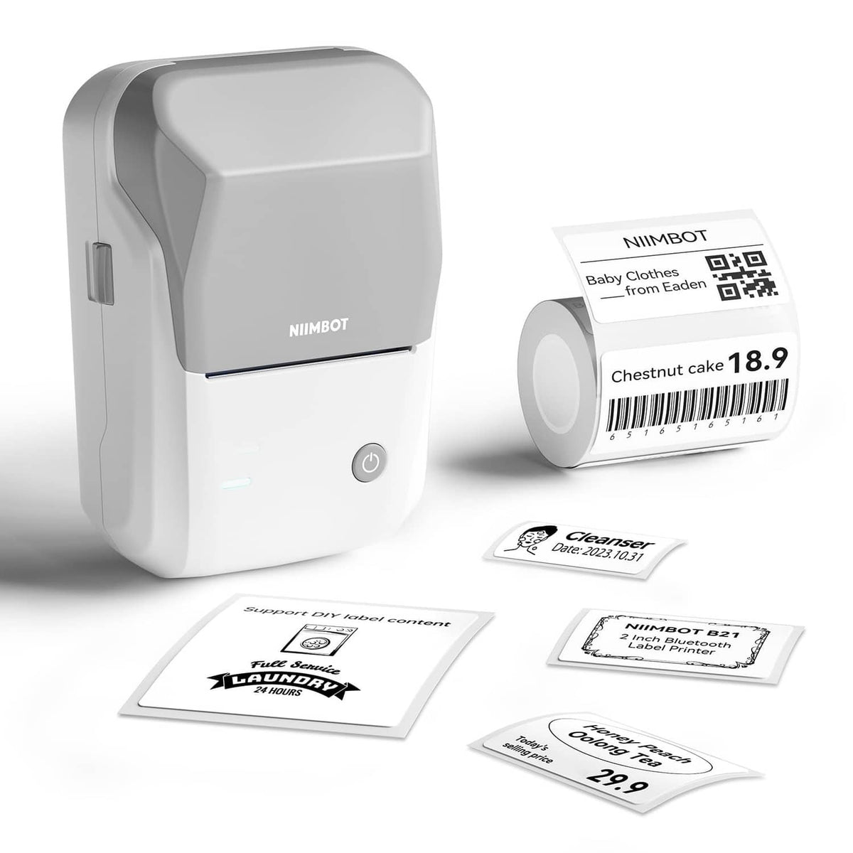 Grey NIIMBOT Bluetooth label printer with label roll and example stickers