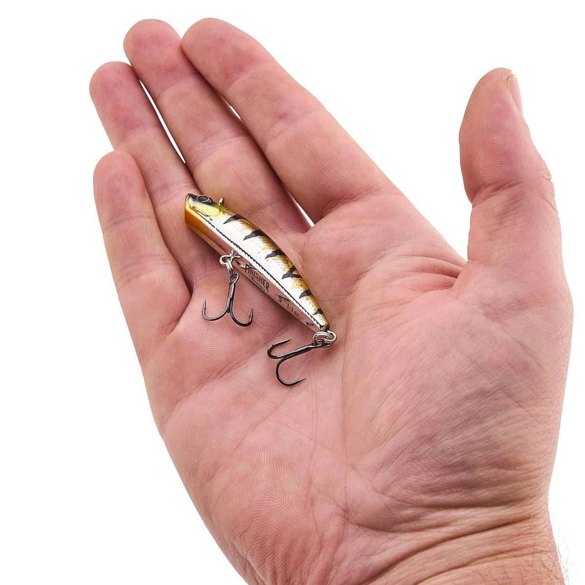 Fishing lure shown in hand, yellow-green and black speckled finish with treble hooks