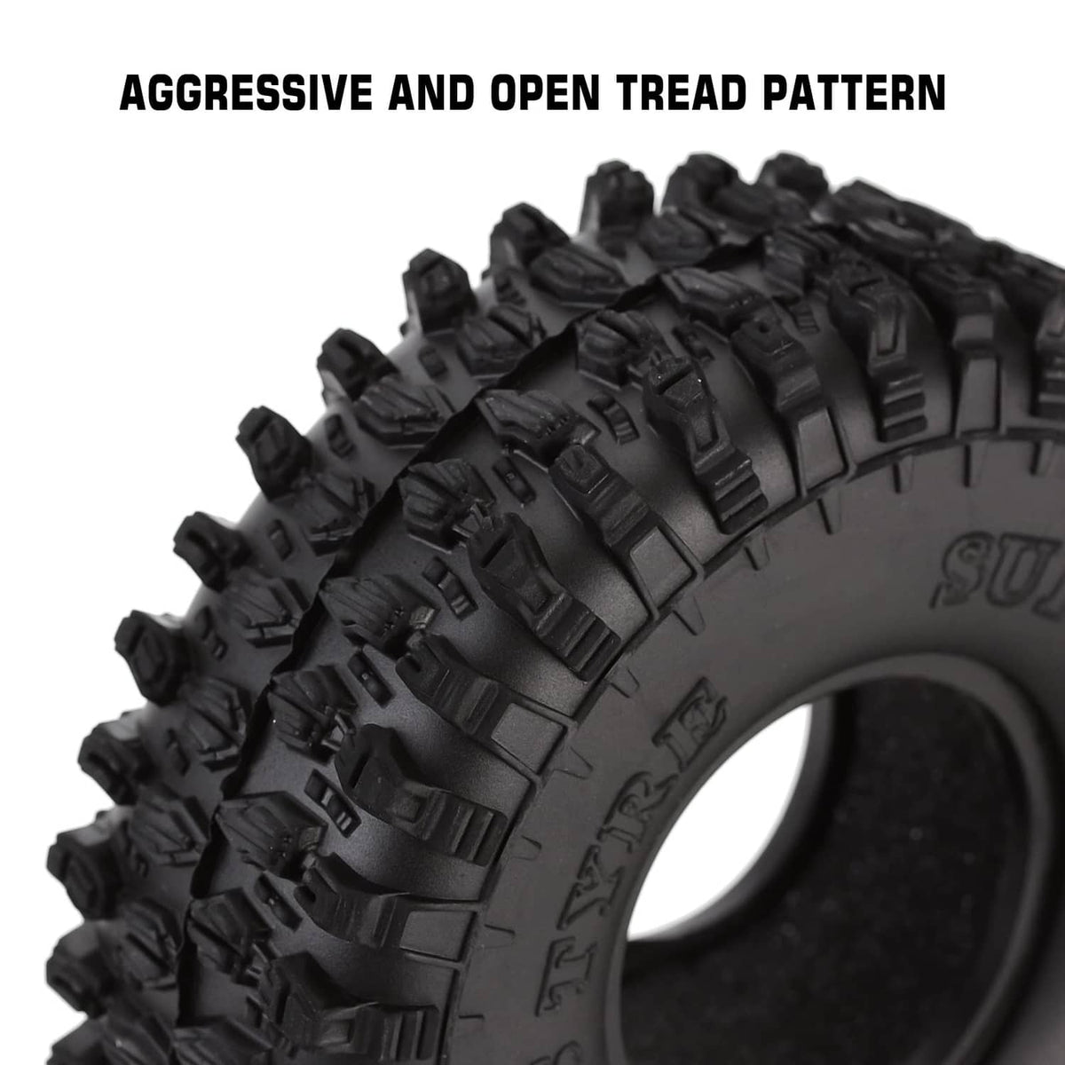 Black tire side with deep open tread blocks and raised traction lugs
