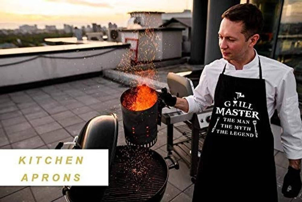 Person wearing a black grill-themed apron while grilling over a white shirt.