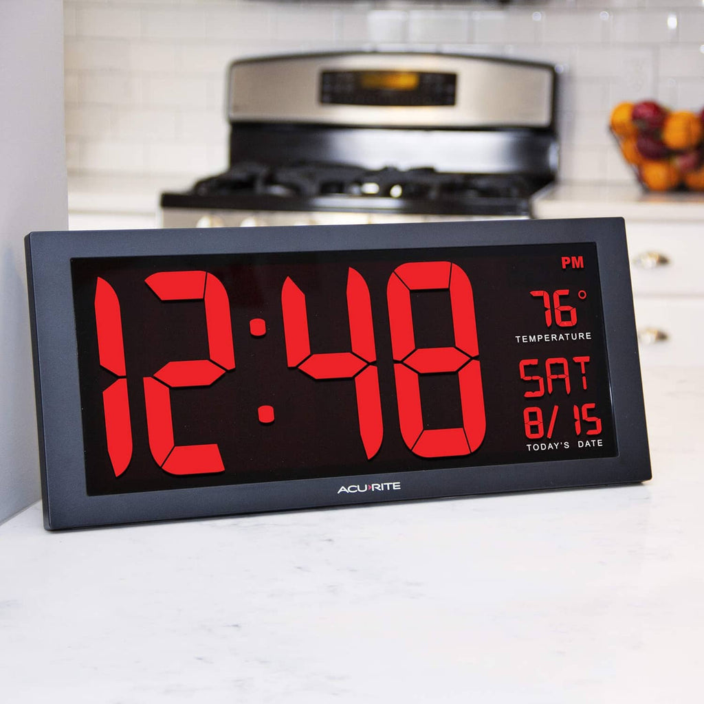 Acurite digital clock on stand, black face with red LED time, temp, and date