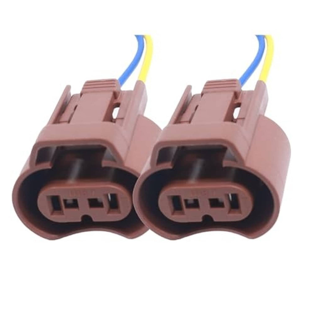 Two brown female headlight wiring connectors with terminal openings and blue/yellow leads