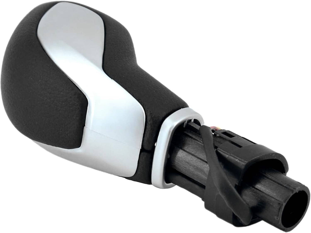 Black-and-silver automatic shift knob with plastic connector housing on base