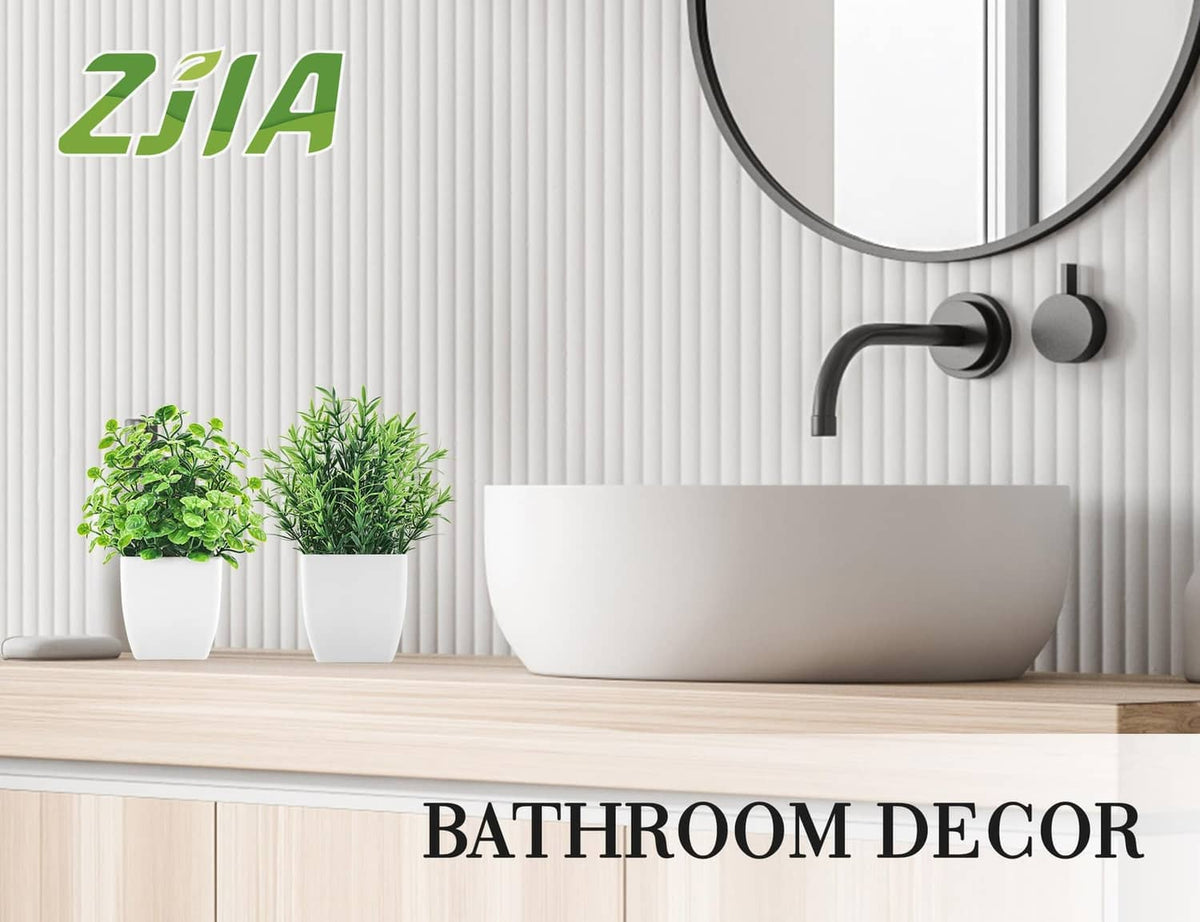 ZJIA 2-pack artificial plants: two small green plants in white pots on shelf.