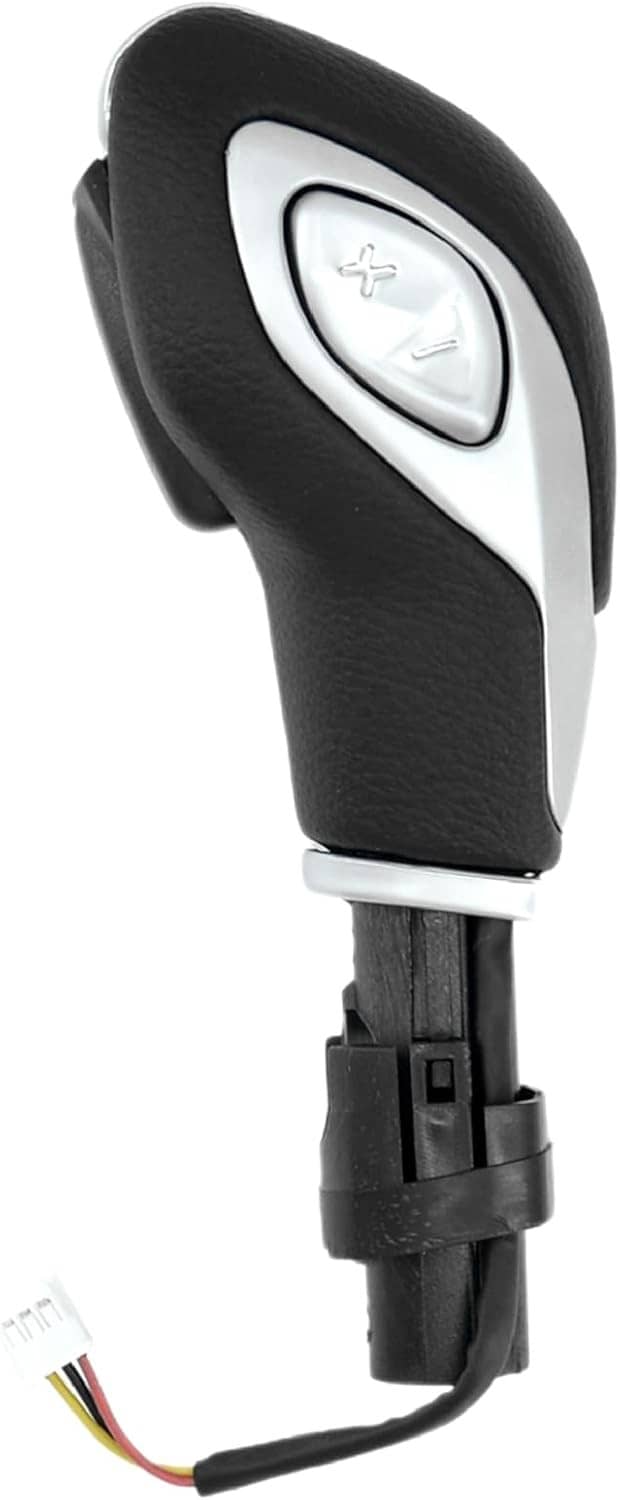 Side view of automatic gear shift knob with silver accent and cable harness