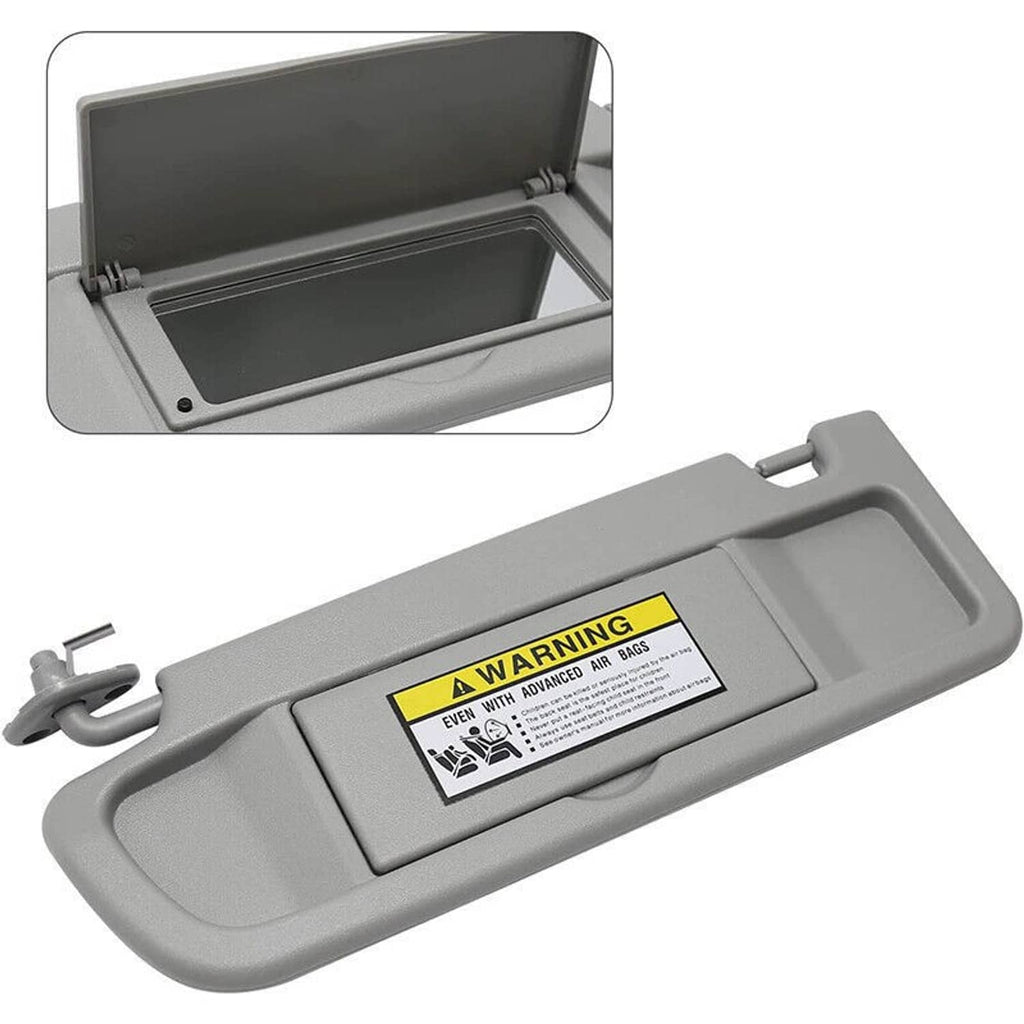 Light gray left driver-side car sun visor with air bag warning label