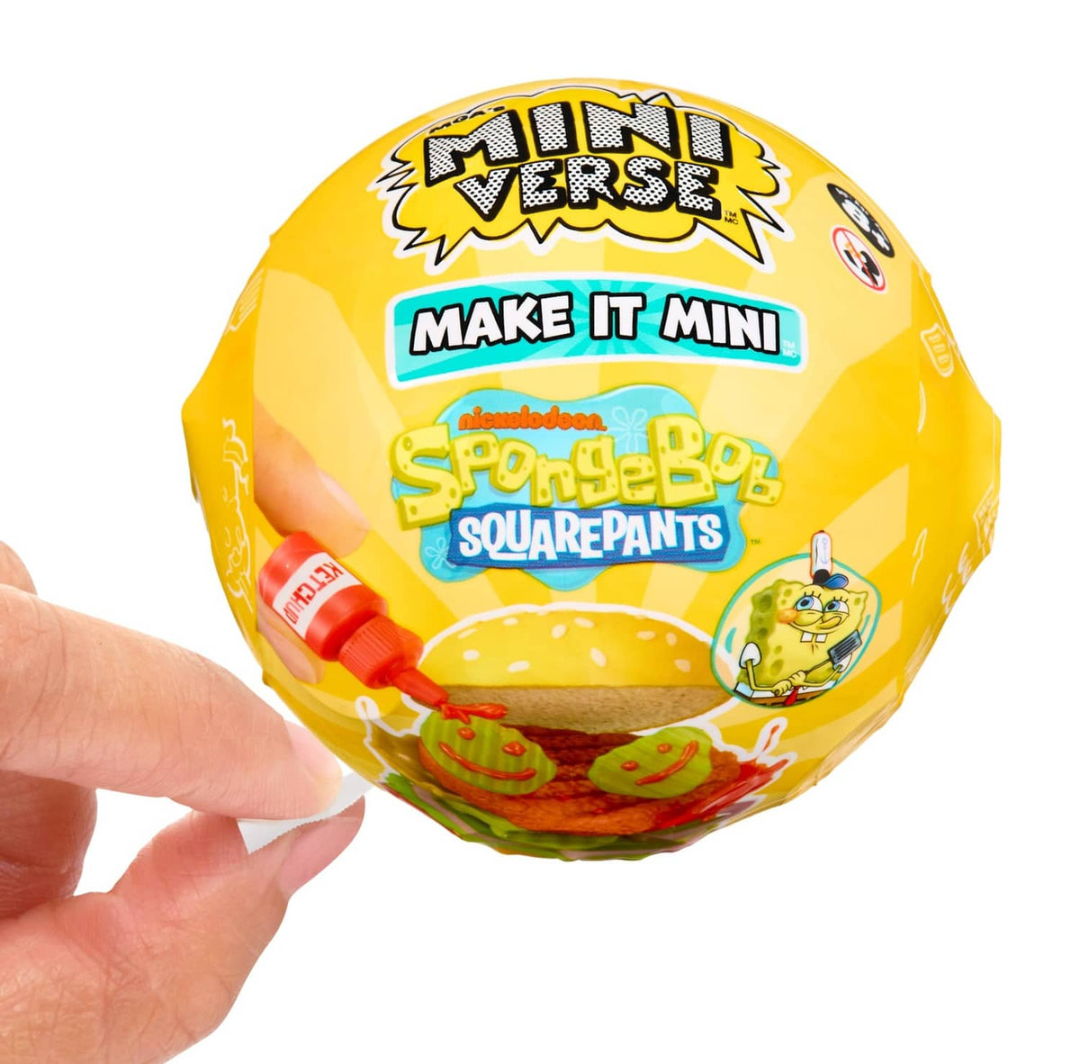 Close-up of yellow SpongeBob-themed mini capsule held in hands