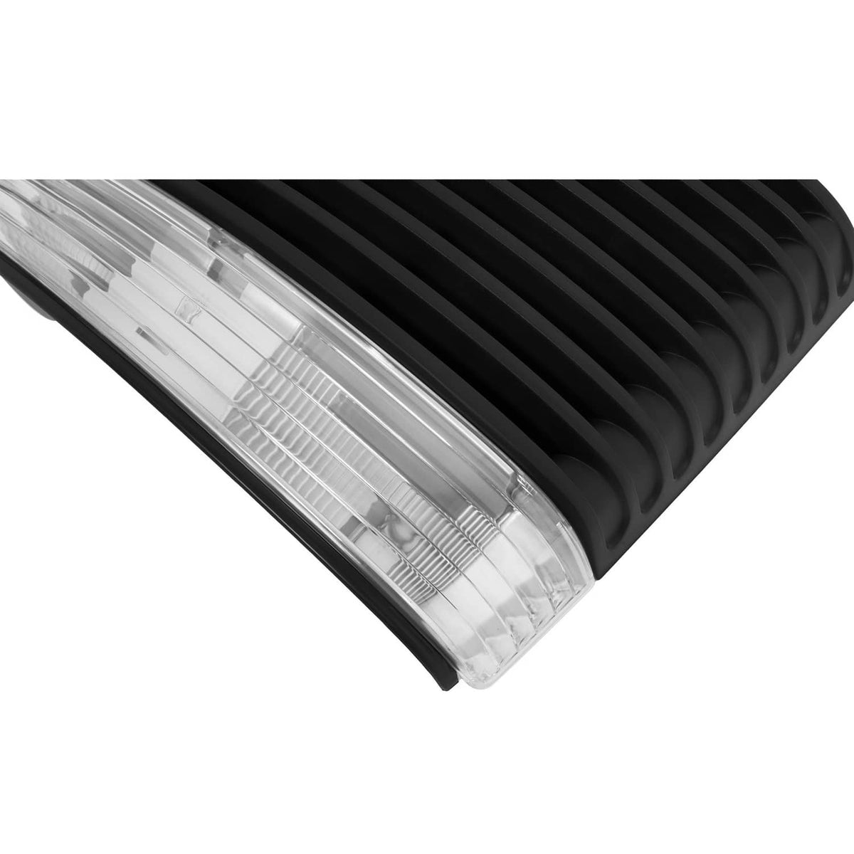 Close-up of clear headlight lens set into black hood grille with slats