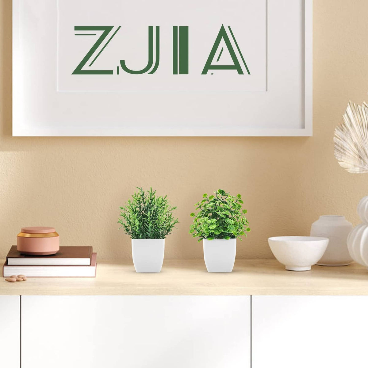 ZJIA 2-pack artificial plants: two small green plants in white pots on shelf.