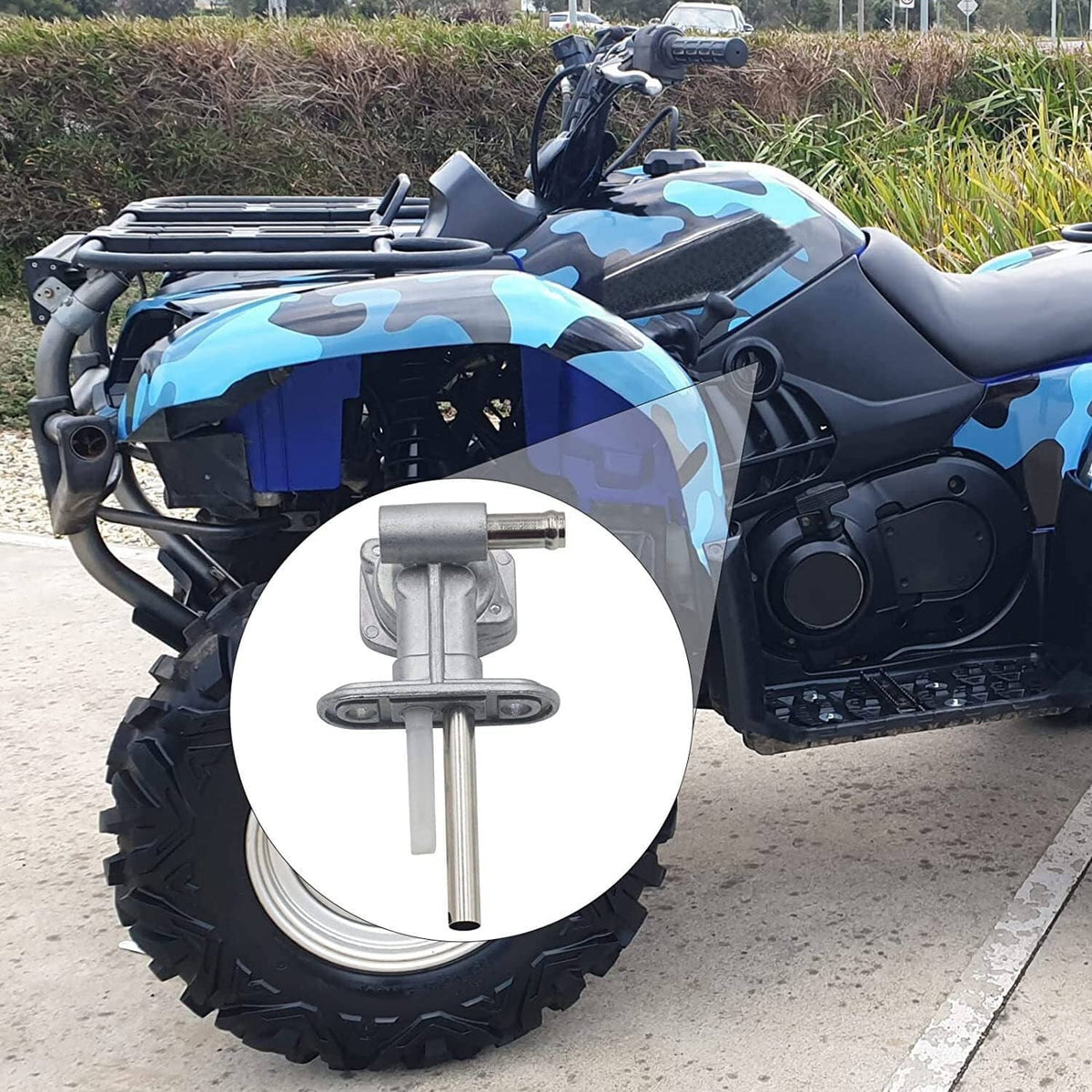 Fuel petcock valve installed on a blue and camo ATV front side