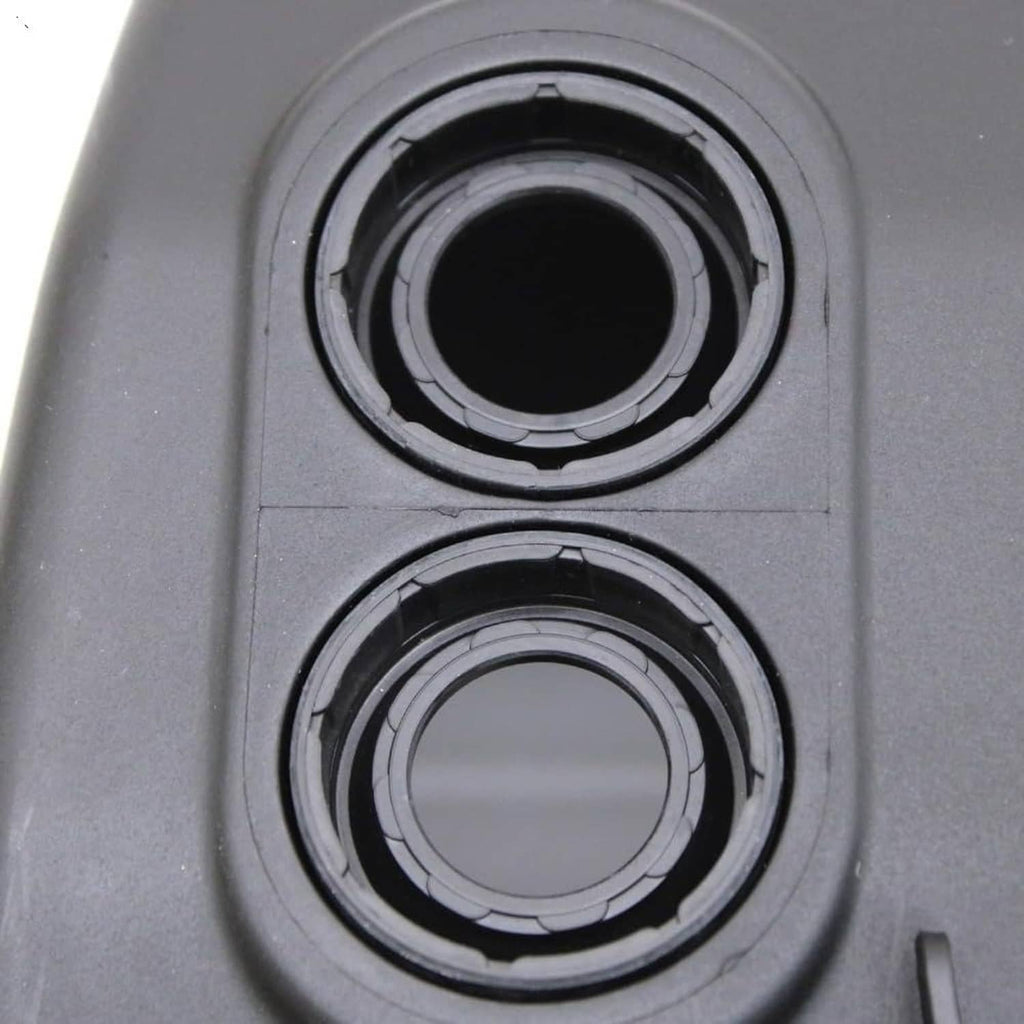 Valve cover gasket sealing rings around two circular openings on the black cover
