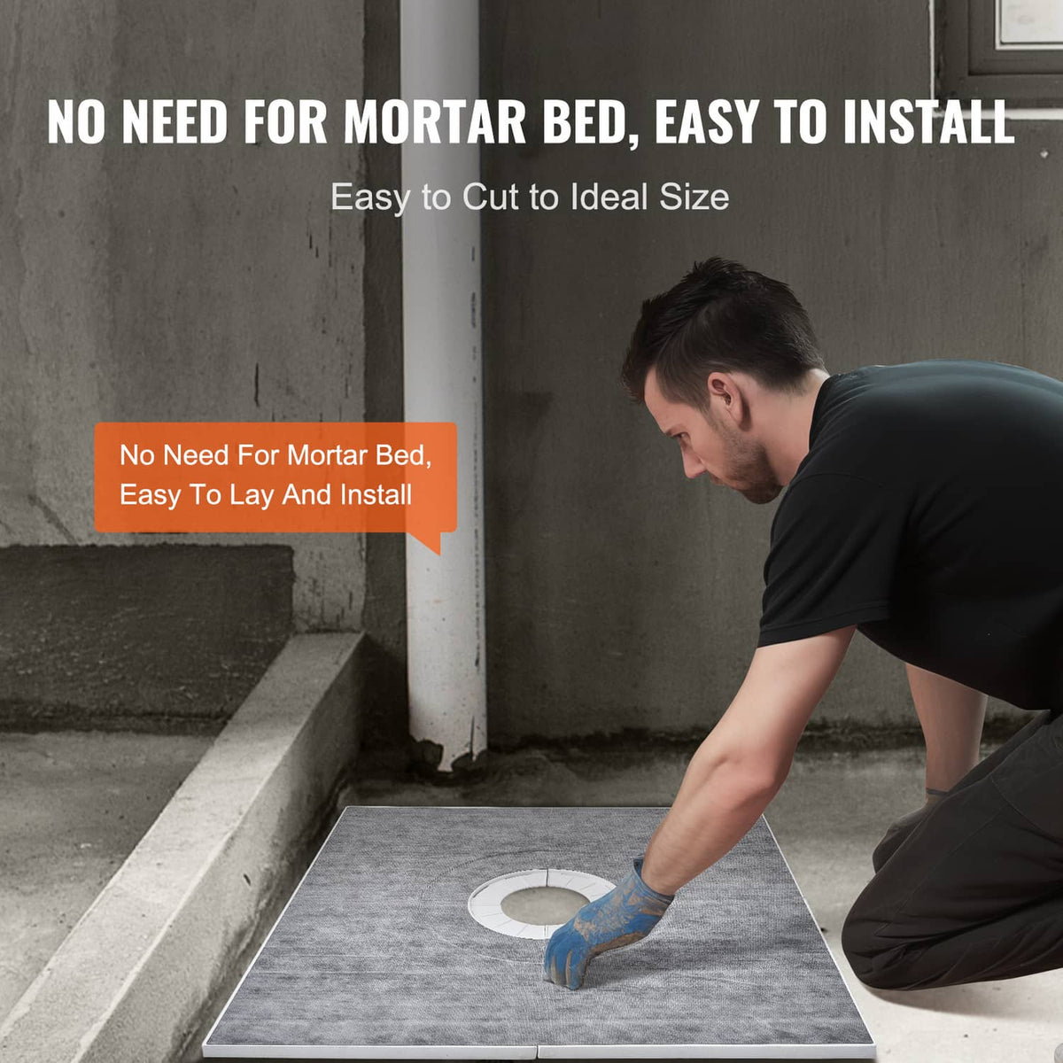 Gray shower curb tray kit being laid on a floor with central drain opening