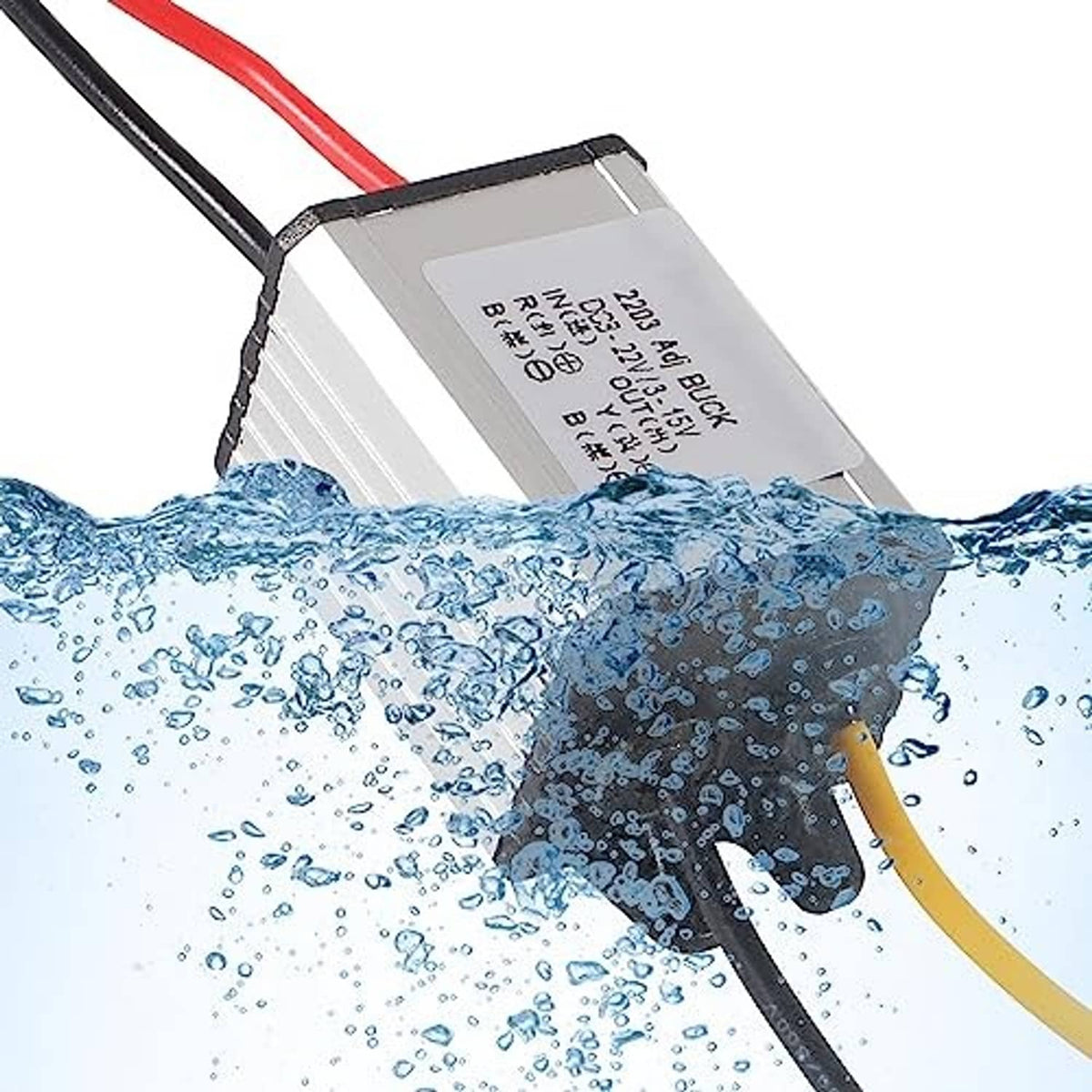 Waterproof DC buck converter module with wires, shown above splash water droplets