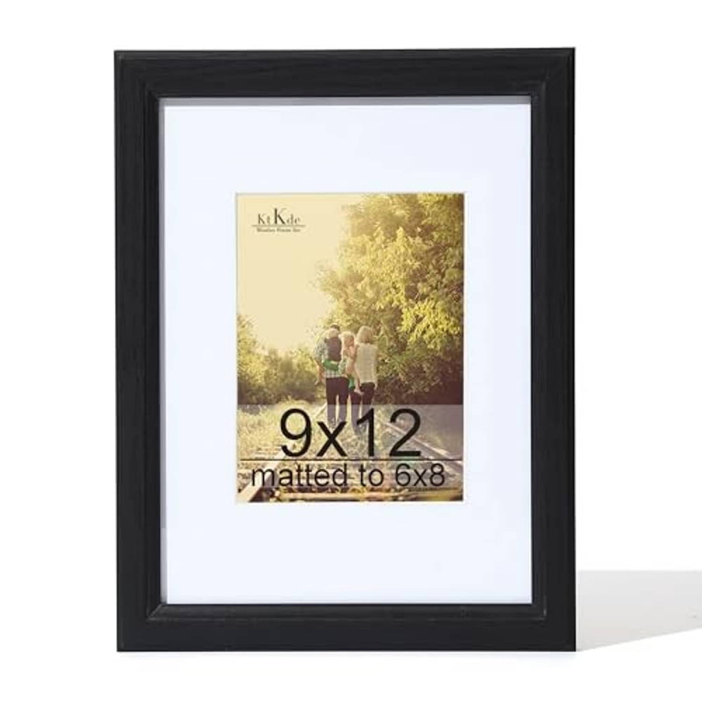 Black woodgrain picture frame with white mat, angled view for 9x12 photo