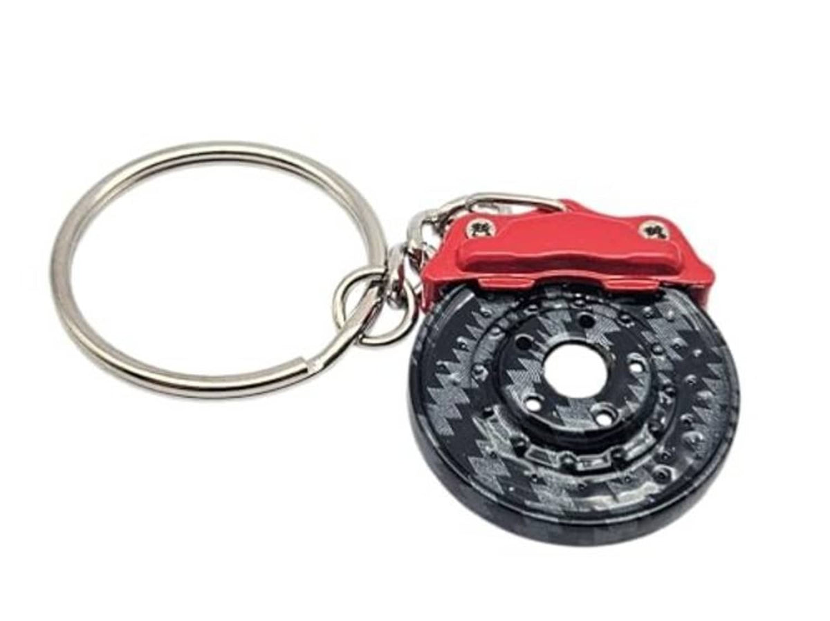 Red brake caliper and carbon-fiber wheel keychain with metal key ring