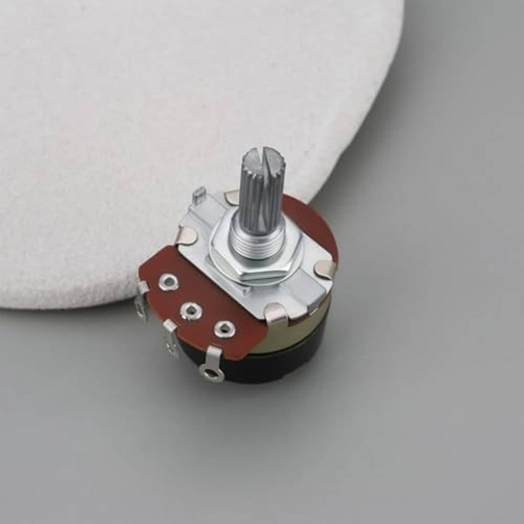 Rotary potentiometer top view with knurled metal shaft and red-brown contact area