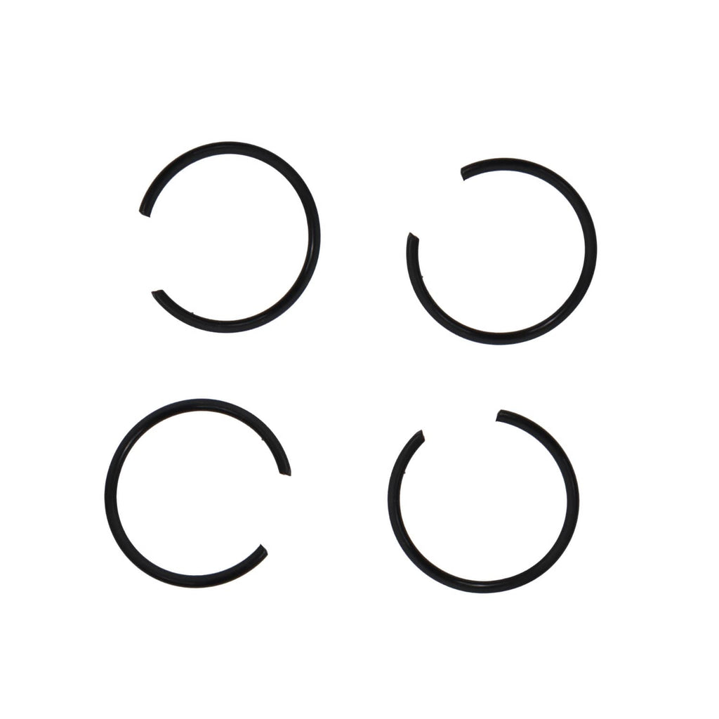 Four black piston rings, C-shaped