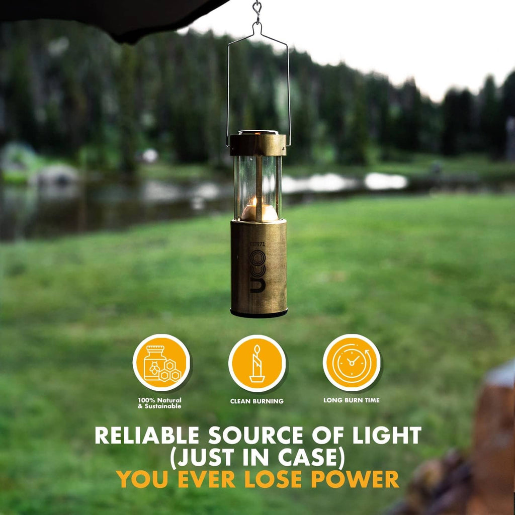 Hanging natural beeswax emergency candle in metal holder, lit flame