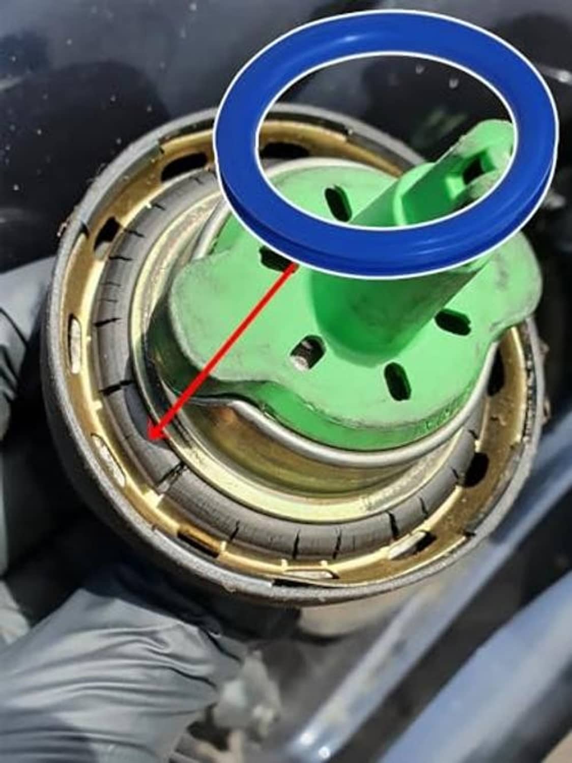 Blue fuel filler cap seal O-ring fitted near vehicle filler opening