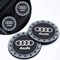 Set of Audi logo car cup holder coasters, round grey outer ring with black textured centers