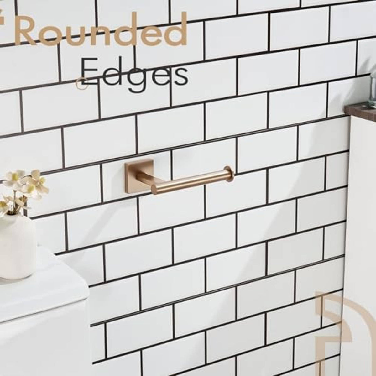 Rounded-edge champagne bronze vertical toilet paper holder mounted on wall