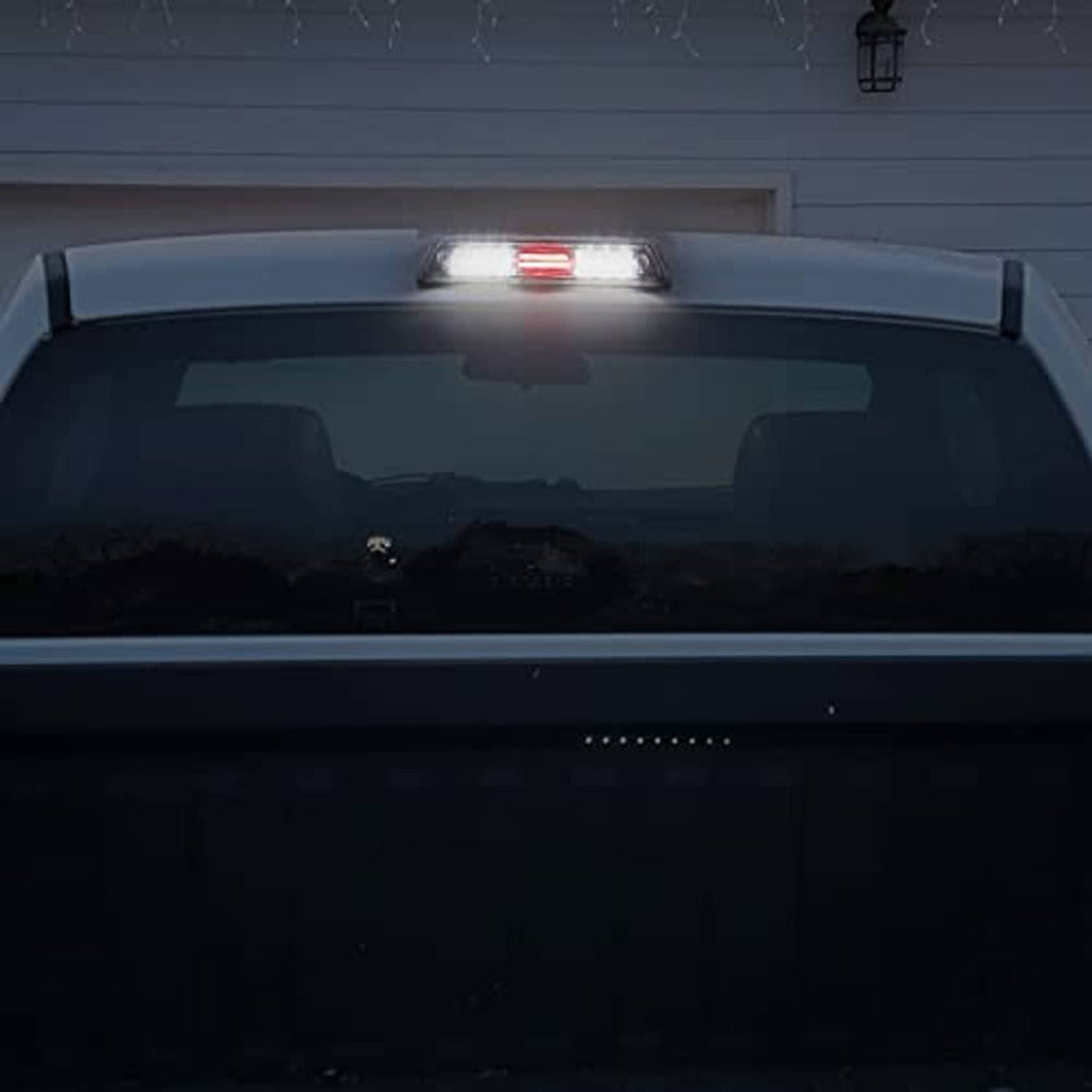 LED 3rd brake light glowing red at vehicle rear, clear lens strip