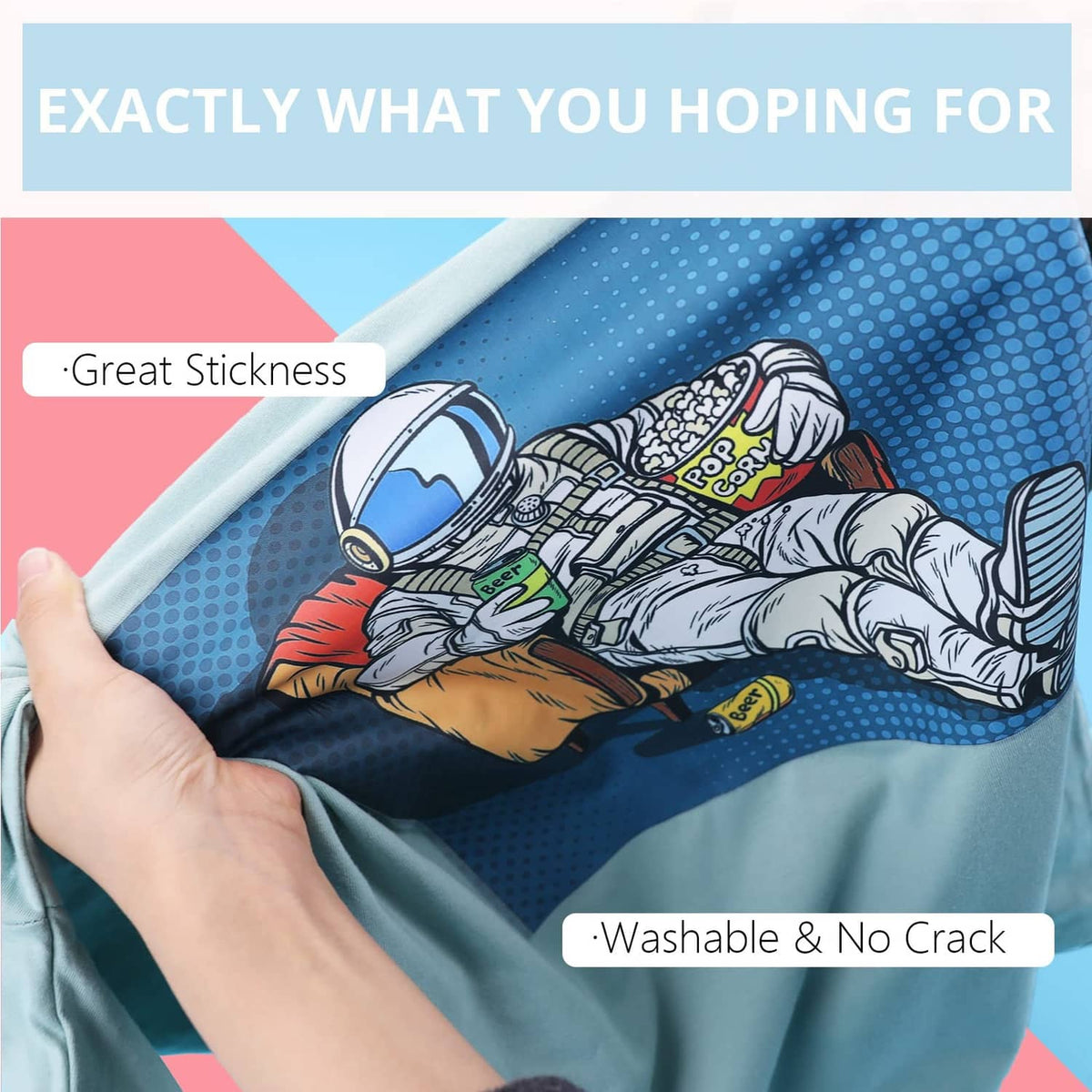 Sublimation HTV transfer sheet on blue fabric, hand smoothing over cartoon print design
