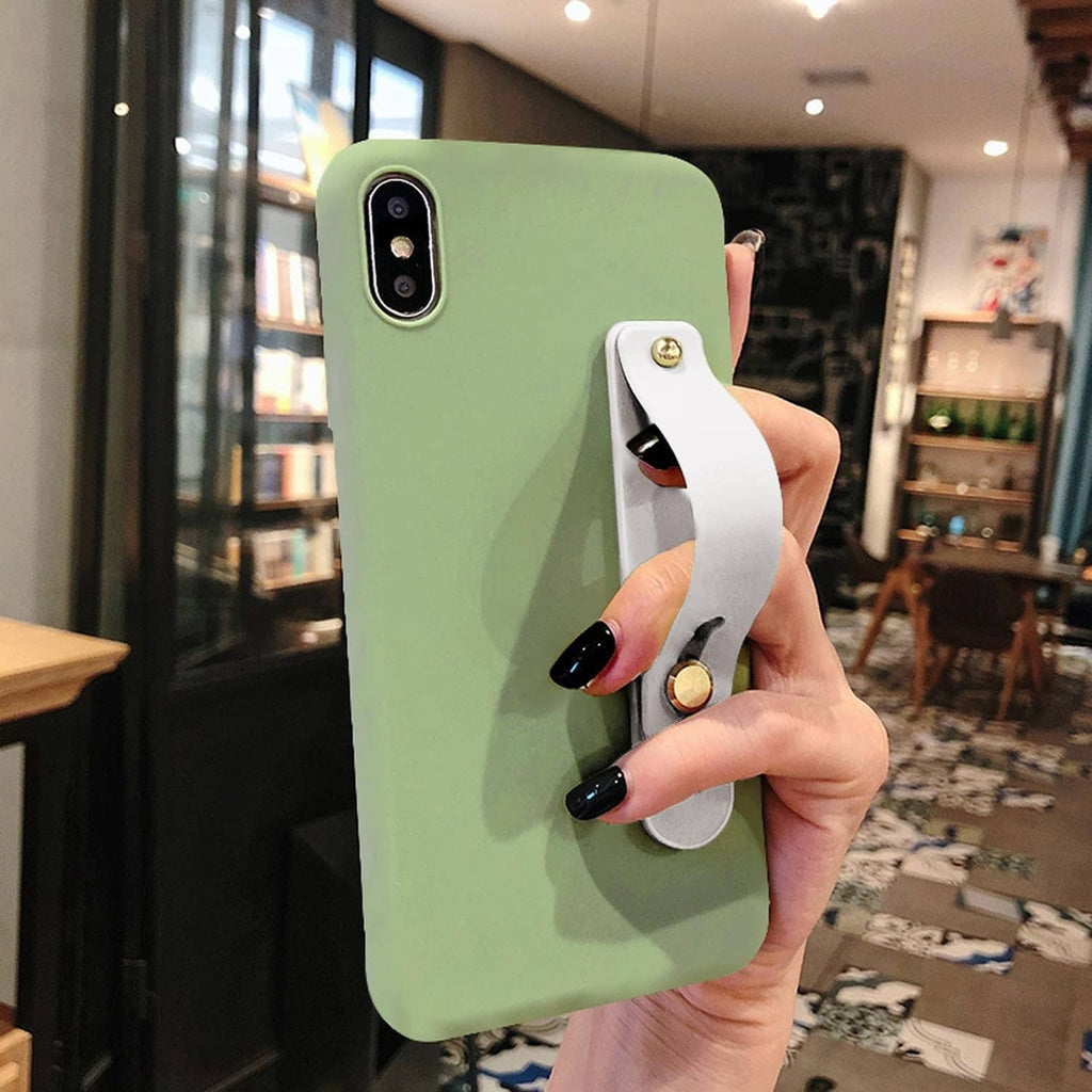 Green phone in hand with white finger strap holder and gold circular accent