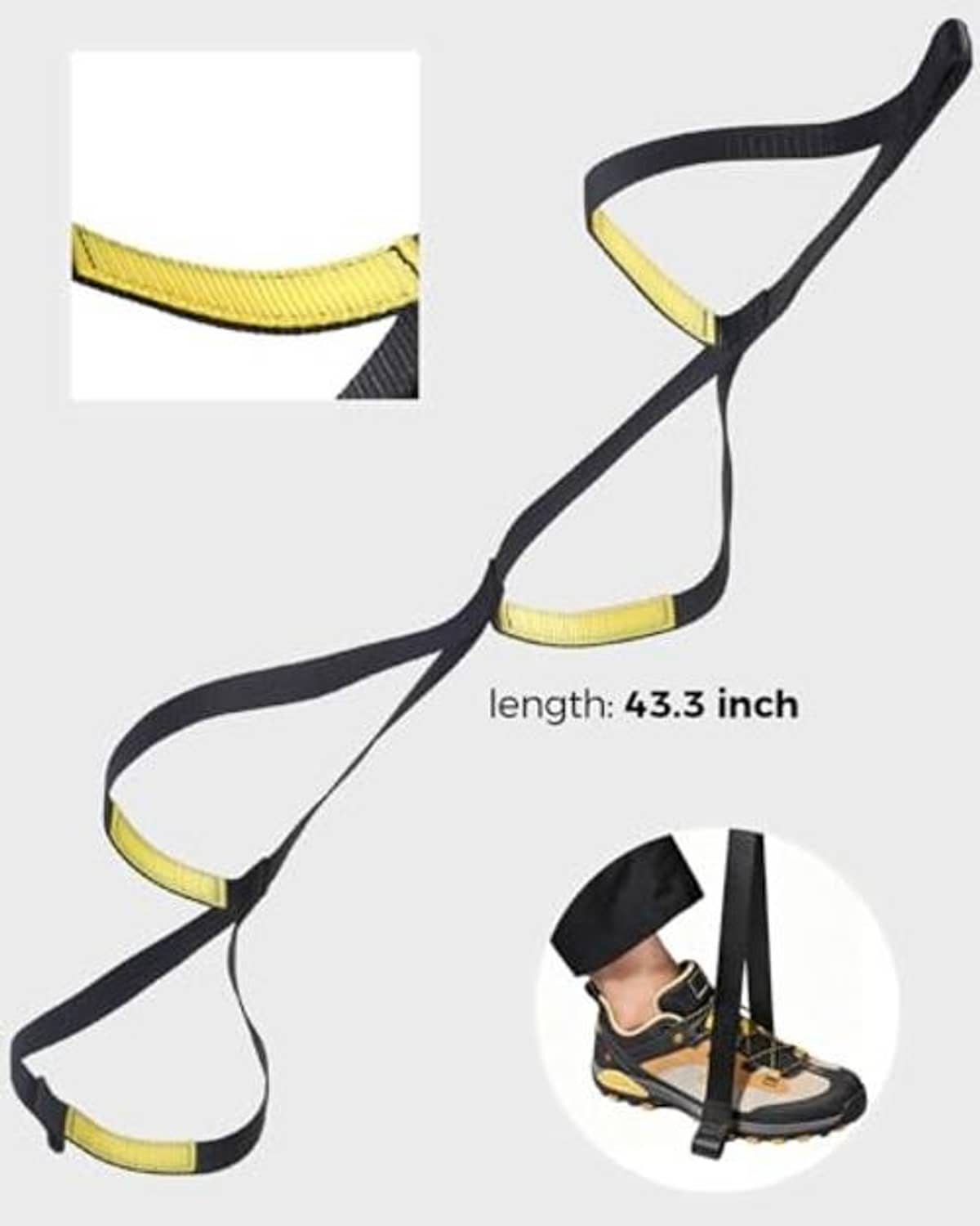 Foot ascender loop strap shown laid out, black webbing with yellow padded loops