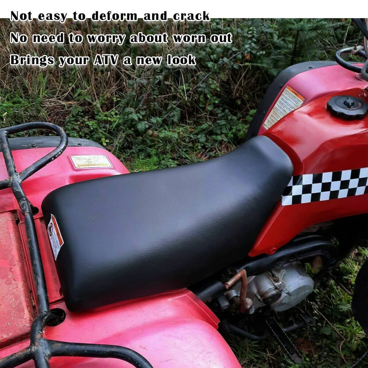 Black ATV seat mounted on red ATV, side profile view