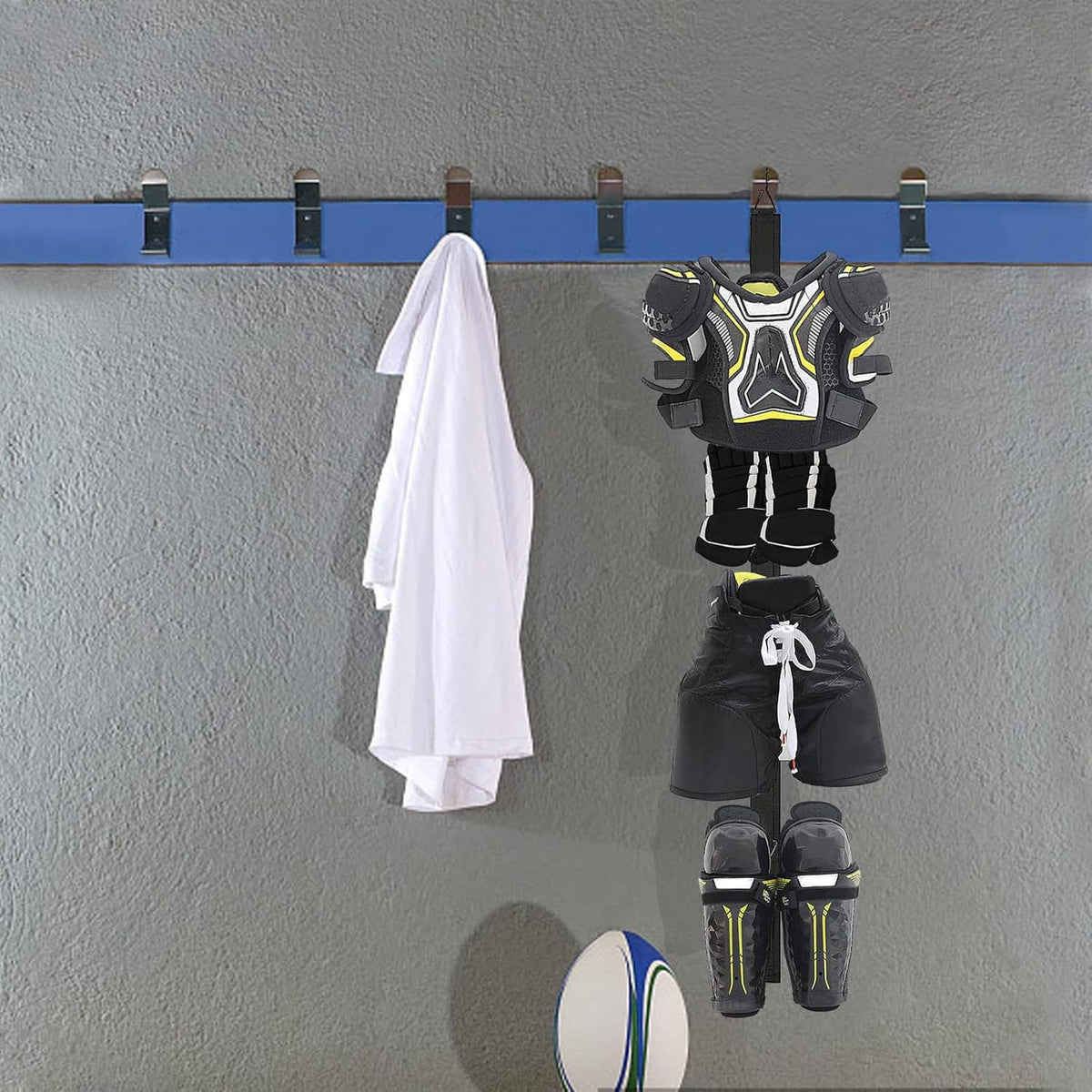 Wall hockey drying rack with hockey shoulder pads, shorts, and shin guards hanging